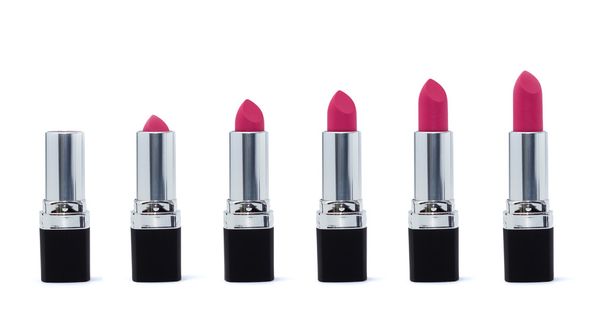 Pink lipstick assorted length in silver black tube isolated on w - Foto, Imagem