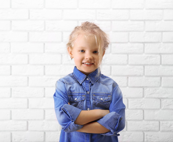 Little girl in jeans suit  - 写真・画像