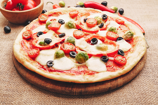 Delicious pizza with cheese and vegetables - Photo, image