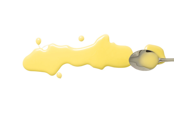 πιτσιλιές και χυθεί το γάλα ζαχαρούχο με ένα κουτάλι - Φωτογραφία, εικόνα