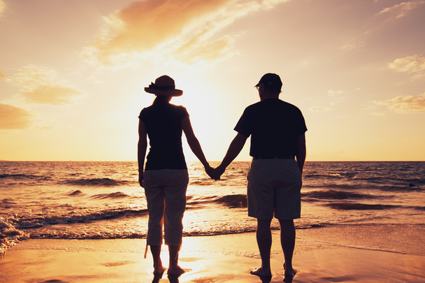 Senior Couple Enjoying Sunset at the Beach - Foto, Bild