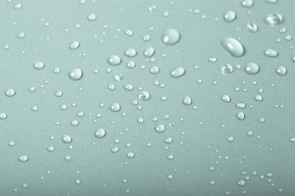 Gotas de agua sobre un fondo de color. Verde. Profundidad superficial de fi
 - Foto, Imagen