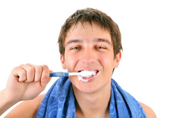 Young Man Brushing his Teeth - Foto, afbeelding
