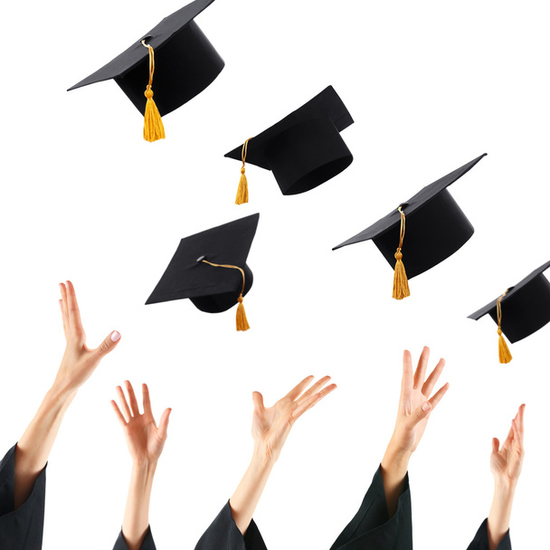 Graduates hands throwing graduation hats - Φωτογραφία, εικόνα