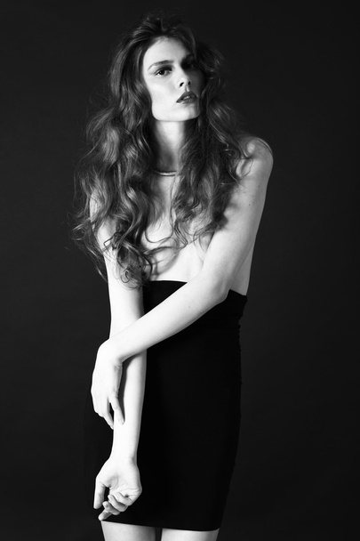 Studio fashion shot of beautiful model, weared black stylish ski - Foto, afbeelding