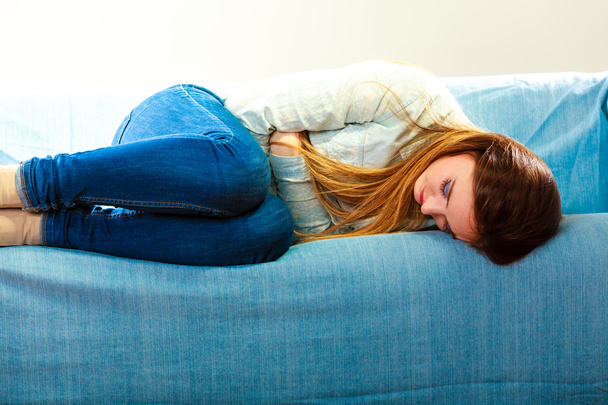 Sad woman laying on couch - Foto, Imagem