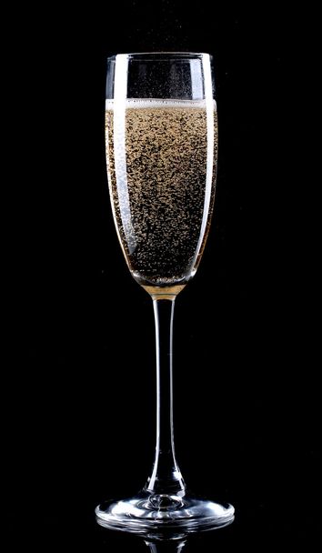 Glass of champagne on black background - Photo, image