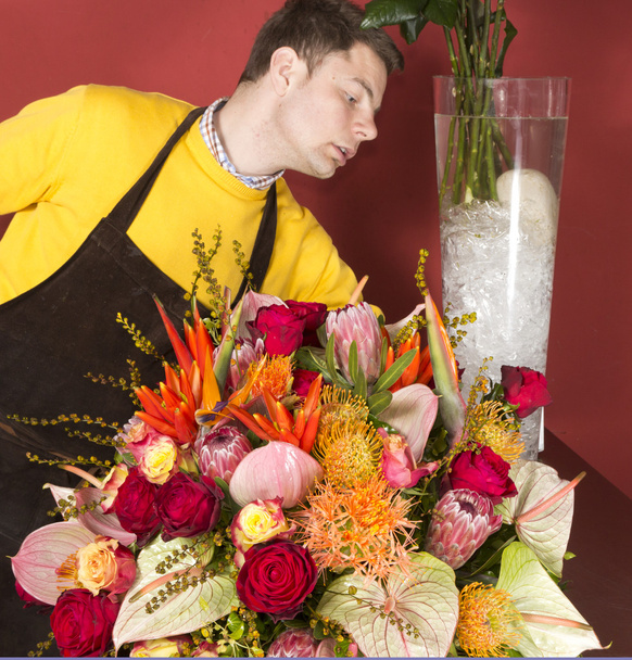 Florist arranging fresh flowers - Фото, изображение