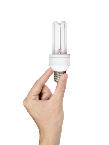 ruka drží žárovku izolované na bílém - Fotografie, Obrázek
