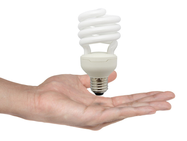 Man holding light bulb in his hand - creativity concept - Φωτογραφία, εικόνα