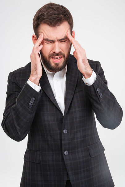 Businessman with headache  - Фото, изображение