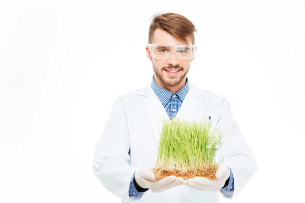 Male engineer showing modified plants - Photo, image