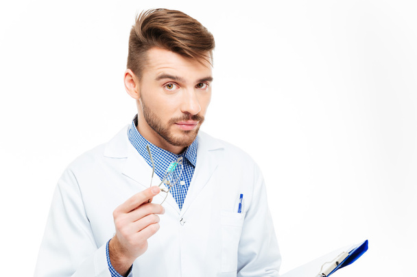 Handsome male doctor looking at camera - Photo, image