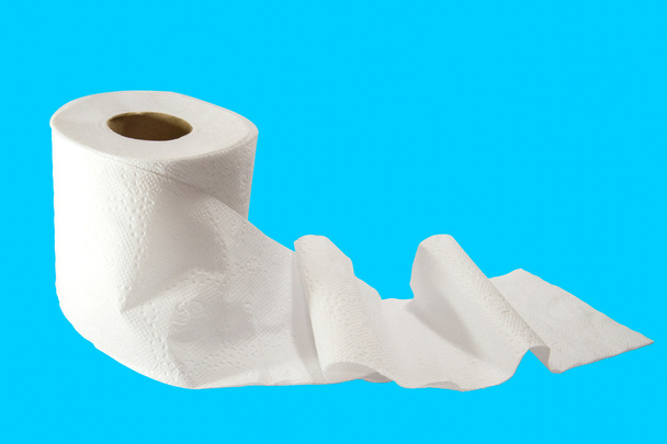 tissue roll on blue background - Photo, Image