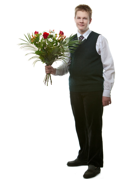 The pupil in a school uniform with a bouquet of flowers - Photo, Image