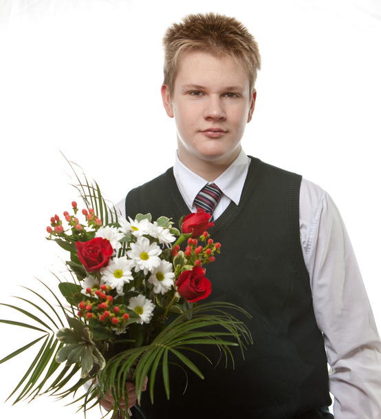 The pupil in a school uniform with a bouquet of flowers - Foto, Bild