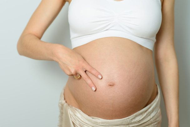 pregnant belly with twins - Фото, зображення
