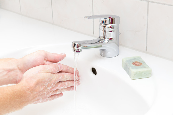 Man washing hands with soap - Photo, Image