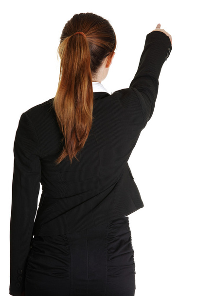 Young business woman pointing at something - Photo, image