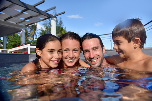 Happy family in swimming-pool - Zdjęcie, obraz