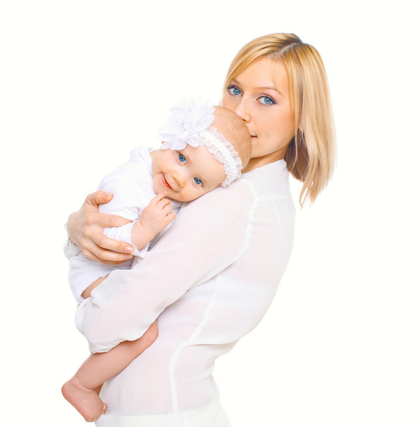 Happy mother hugging baby on a white background - Foto, imagen