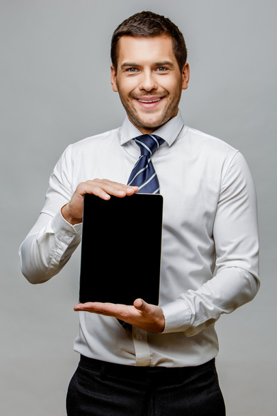 Handsome stylish businessman on grey background - Photo, image
