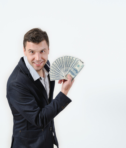 Businessman with bundle of money on a white background - 写真・画像