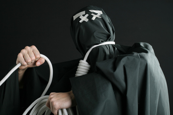 Black mime with rope on neck - Valokuva, kuva