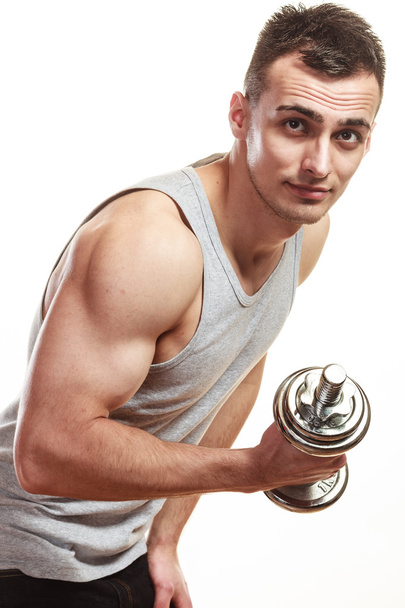 athletic man working with heavy dumbbells - Photo, Image