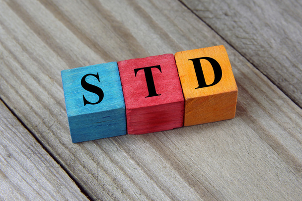 STD (Sexually transmitted infections) acronym on colorful wooden - Photo, Image