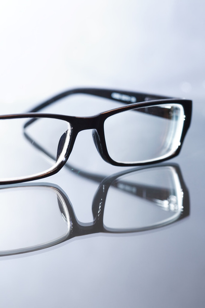 Modern Eyeglasses On Glass - Photo, Image