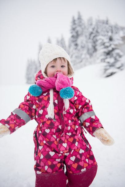 little girl have fun at snowy winter day - Zdjęcie, obraz