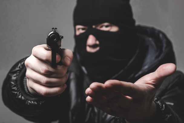 Ladrón con una ametralladora
 - Foto, Imagen