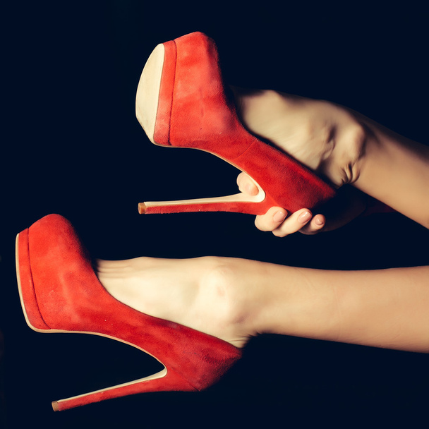 Female legs in red shoes - Foto, Imagen