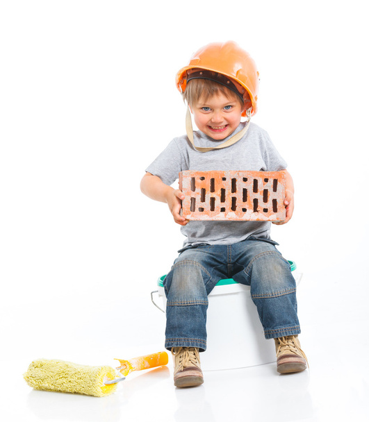 Boy in hard hat with brick - Fotografie, Obrázek