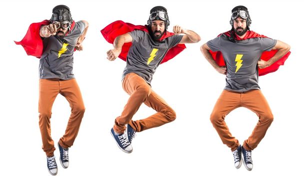 Superhero giving a punch - Foto, Imagen
