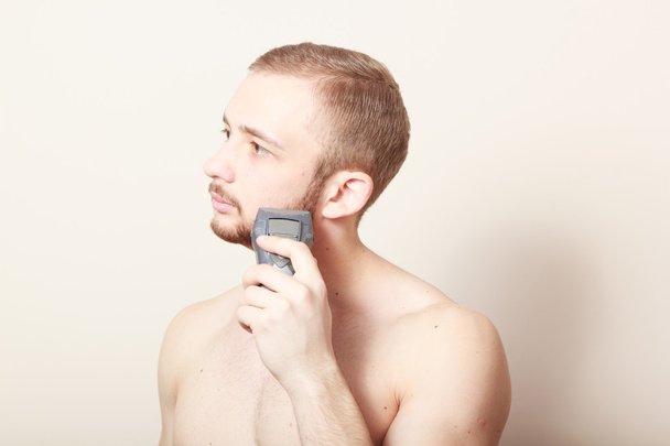 bearded guy shave electric razor - Photo, Image