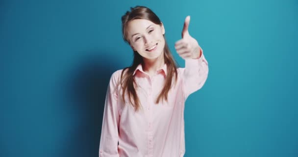 Woman shows success hand sign - Materiał filmowy, wideo