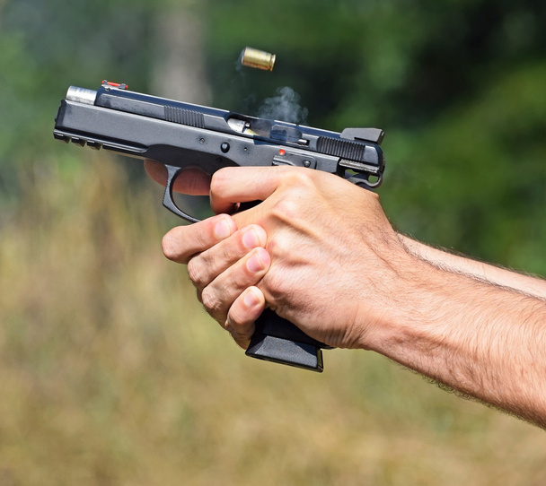 Shooting with a handgun - Photo, Image