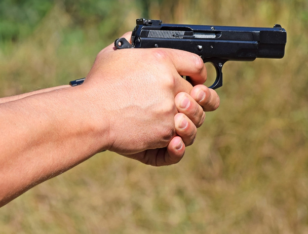 Shooting with a pistol - 写真・画像