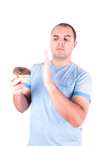 Homem com donut na mão
 - Foto, Imagem