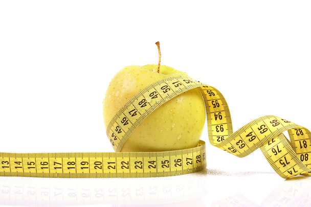 Diet concept. apple with measuring tape - Photo, Image