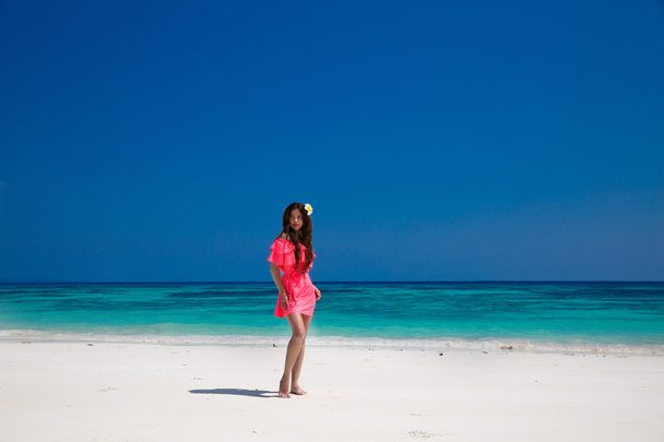 Beautiful woman walking on exotic beach, brunette girl model in  - Φωτογραφία, εικόνα