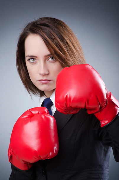 Young businesswoman in boxing concept - Fotó, kép