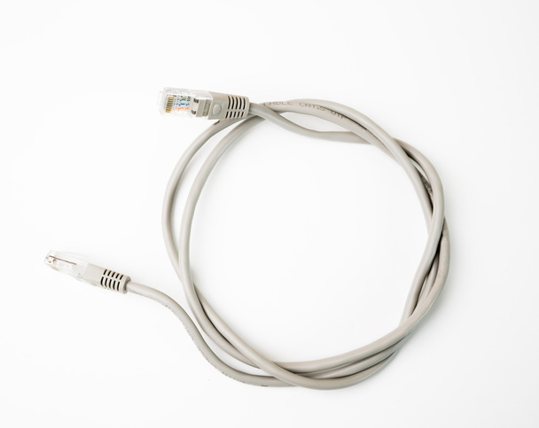 Patch cord network cable with molded RJ45 plug, isolated on a white background - Photo, Image
