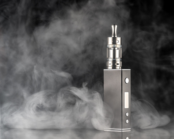 electronic cigarette over a dark background - Zdjęcie, obraz