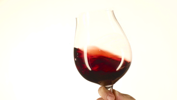 Moving wine glass, white, closeup - Footage, Video