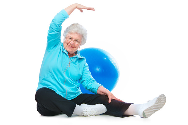 Senior woman doing stretching exercises - Φωτογραφία, εικόνα