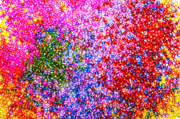 Background of sparkling multicolored glass beads. Saturated color picture for greeting card or background - Photo, Image