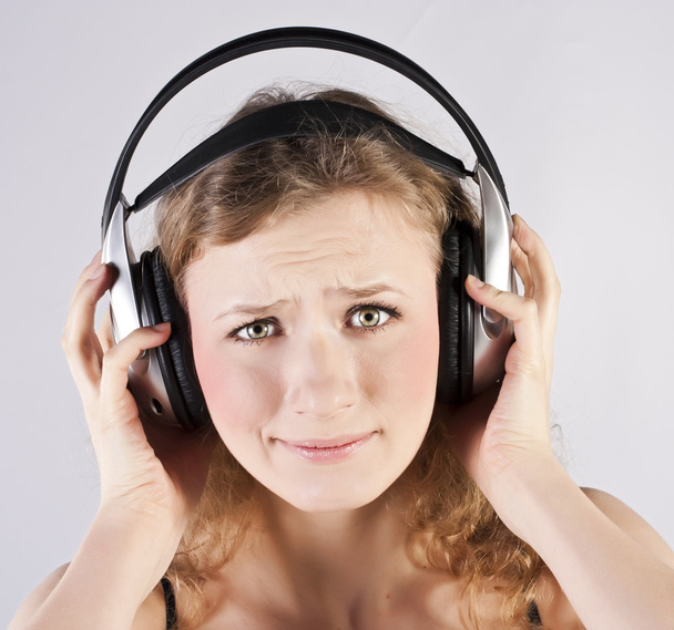 Pretty woman listening, and enjoying music - Фото, изображение